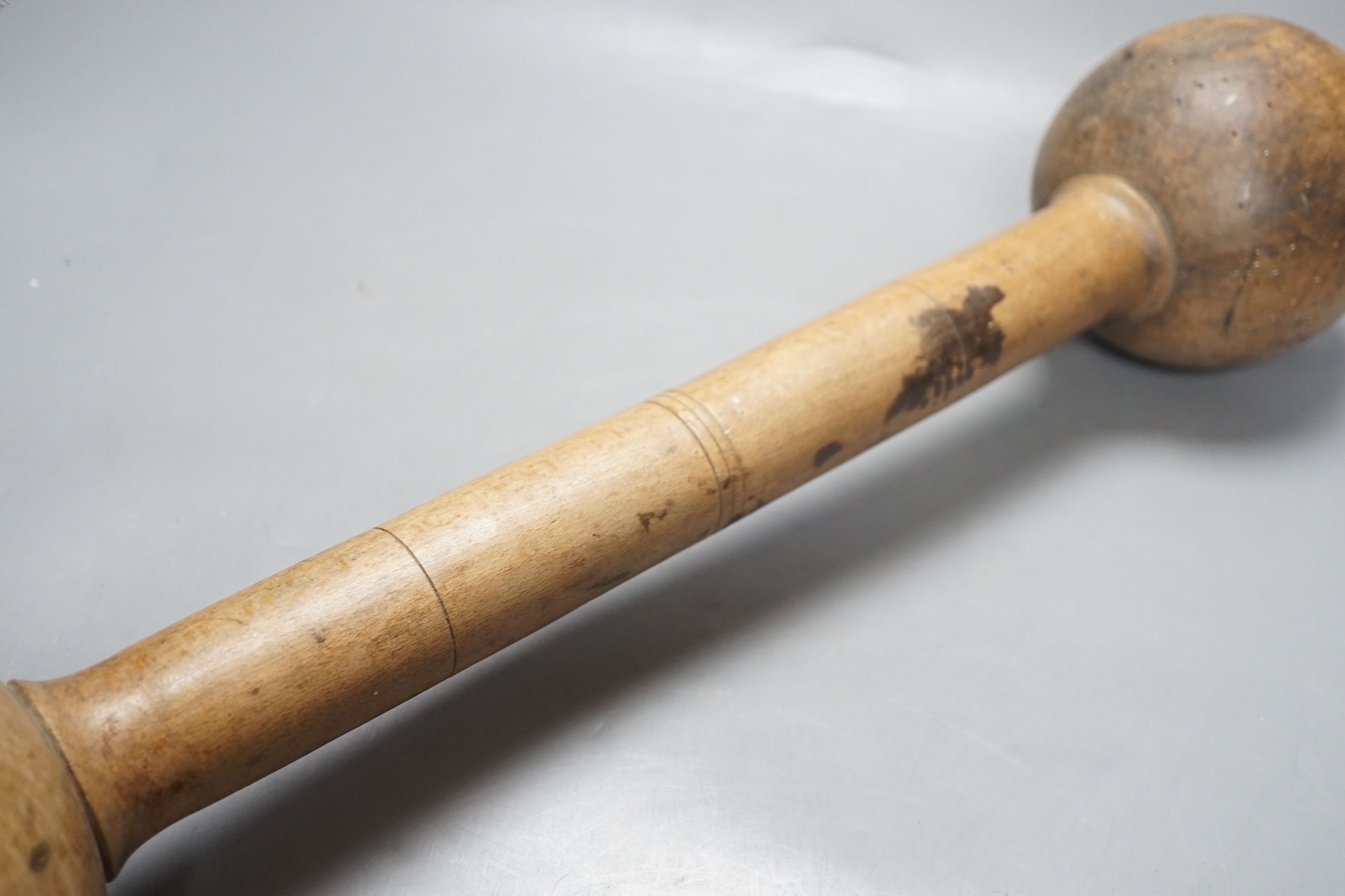 A turned beech wine grape masher - 61cm